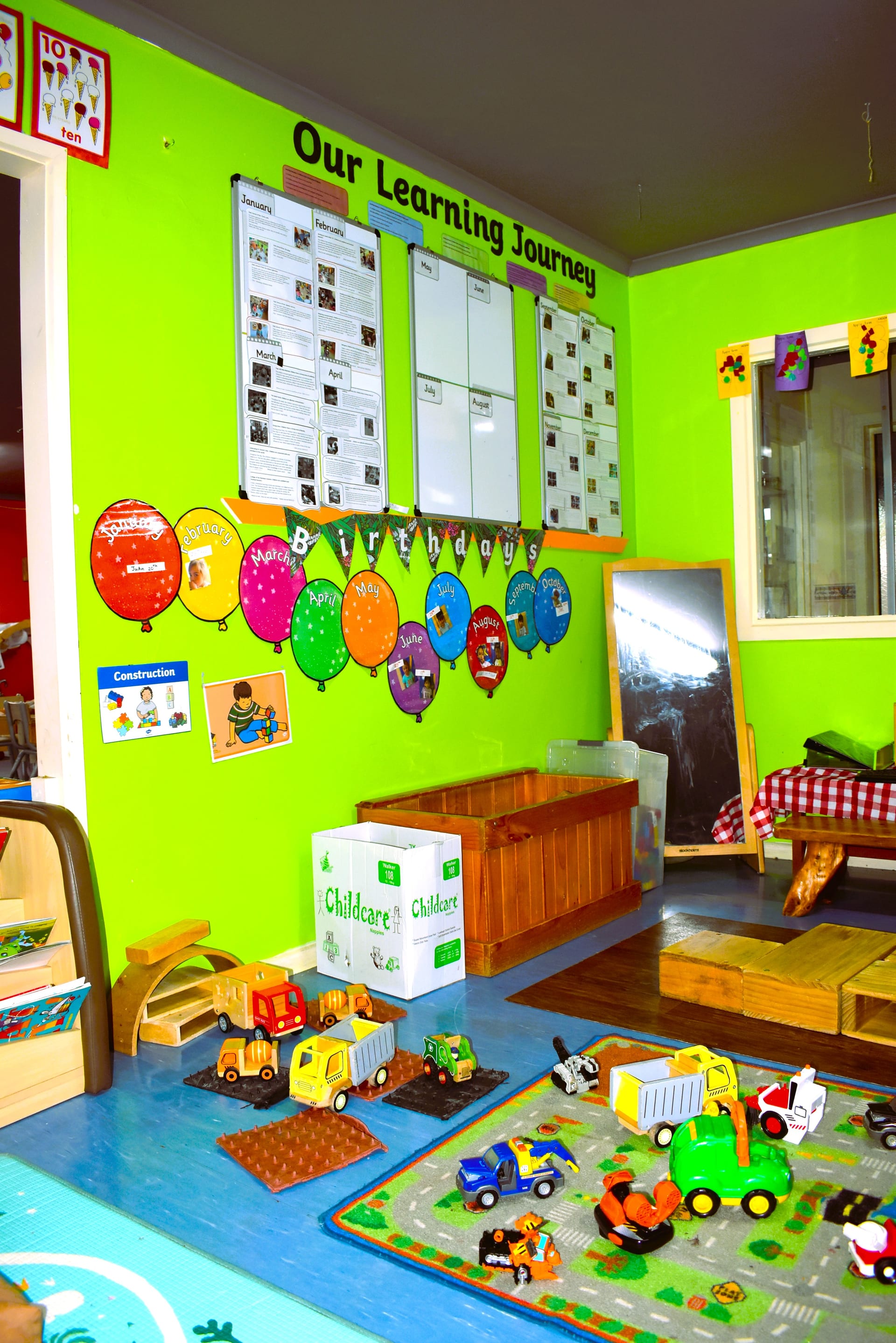 The Green Room at My Stars — open classroom with art easel and learning stations