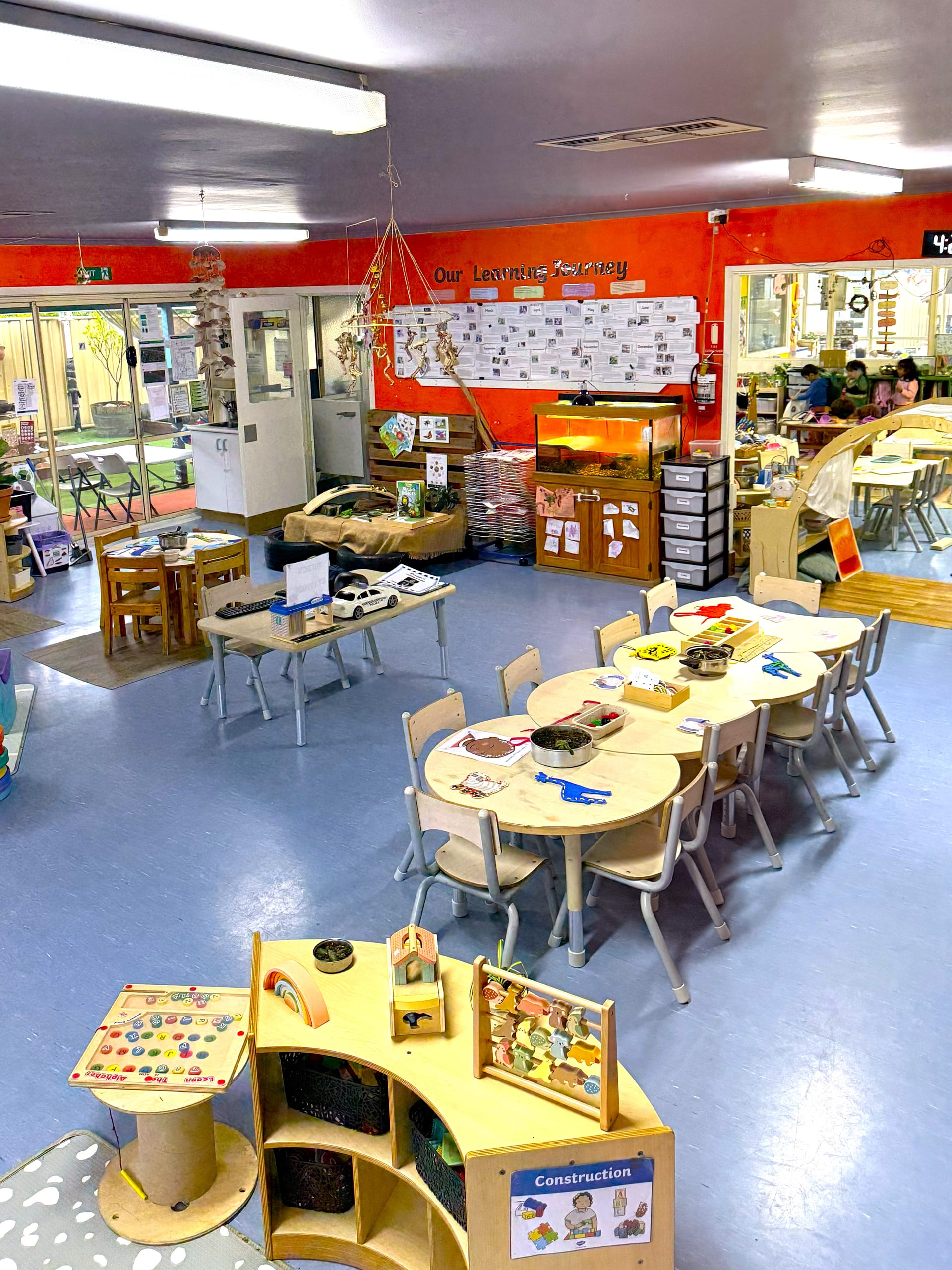 Learning materials — abacus, sand tray and tables set up for the day