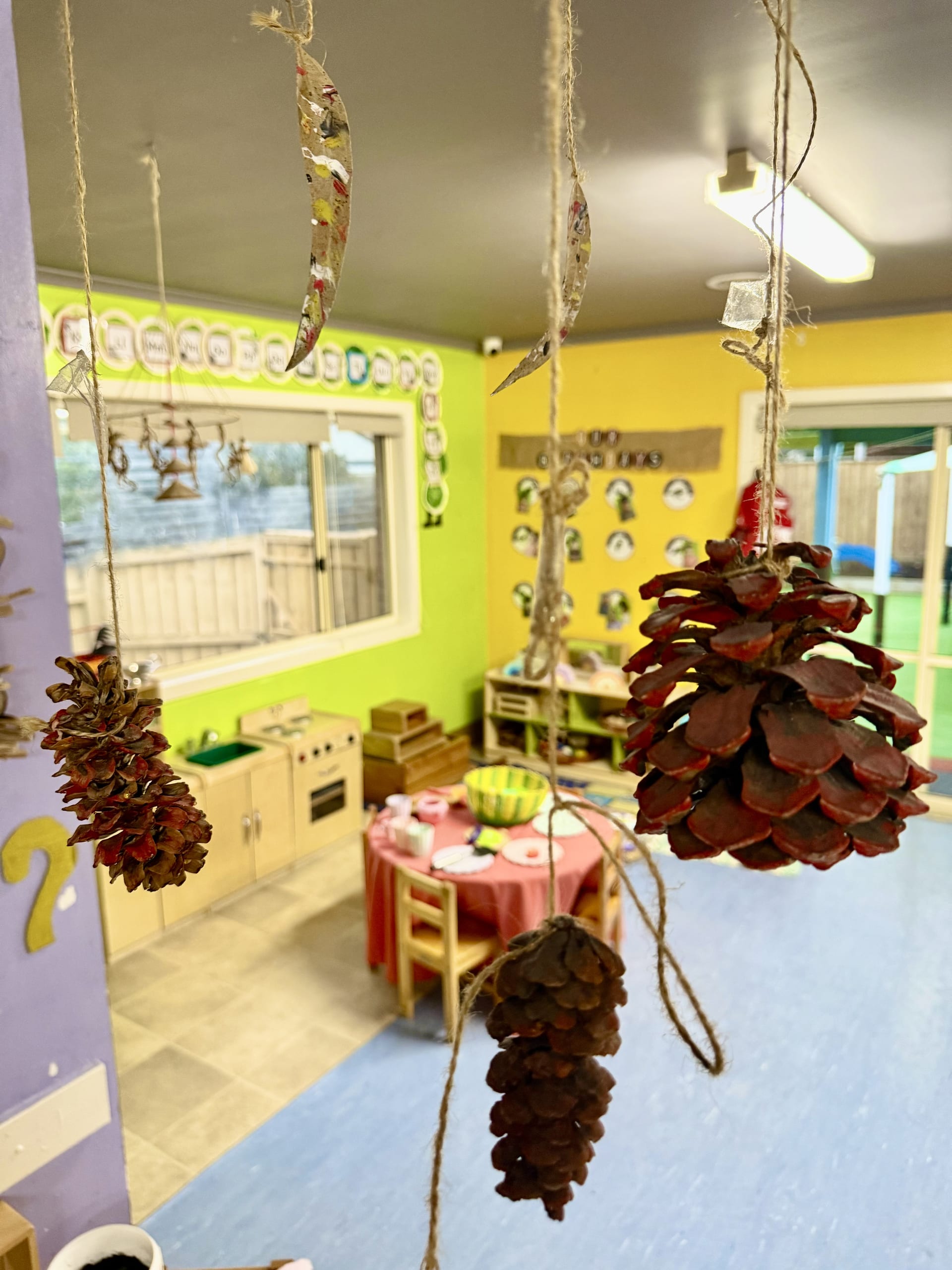 A classroom set up for self-directed activity — tables, easel and learning materials