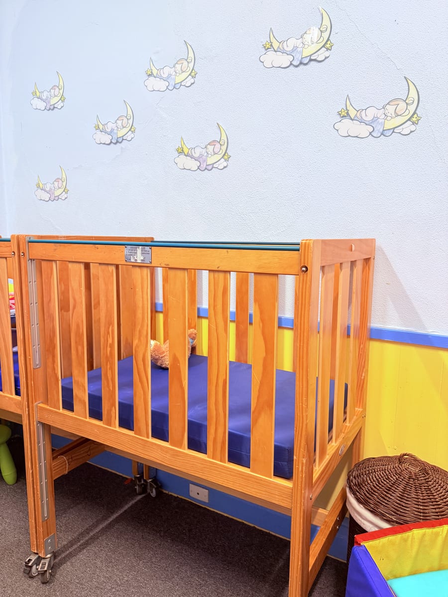 White Room nursery — peaceful cots with moon and stars decor