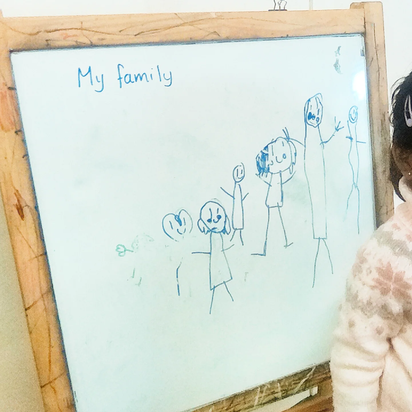 Drawing 'My Family' on the whiteboard